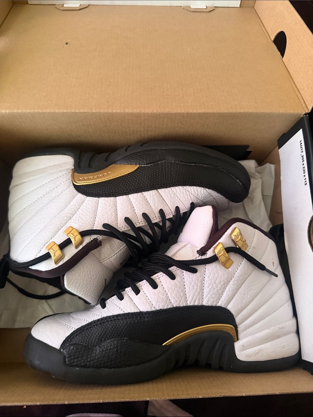 Jordan 12 Taxi Black and White sneakers